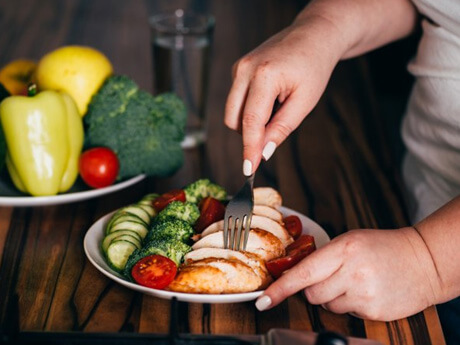 a person preparing to eat a healthy meal