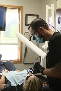 Woman in dental chair smiling