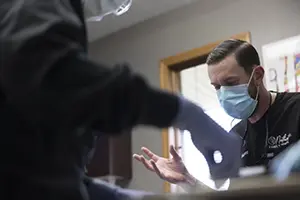 Woman looking at smile during dental office visit