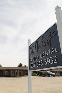 Dentist and dental patient looking at digital x-rays