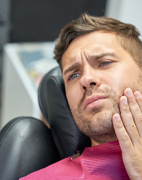 Man at the dentist with a toothache